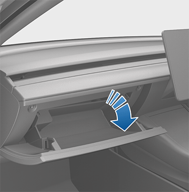 Image with an arrow showing the glove box opening.