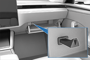 Glovebox open, revealing a USB drive in the USB port