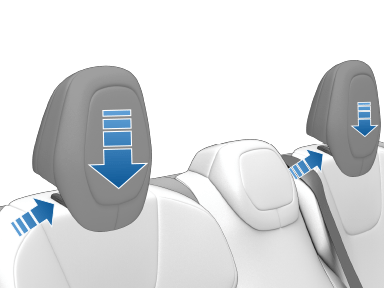 An arrow pointing to a button on the head support base, with an arrow pointing down on the head support cushion