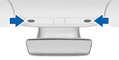 Two buttons on either side of the rear view mirror