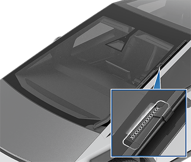 Arrow pointing to the VIN plate on top of the dashboard.