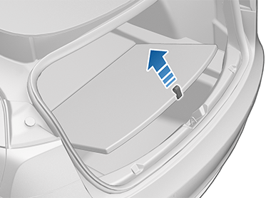 Rear trunk with arrow pointing upwards from cargo cover strap