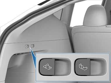 A callout showing a switch on the left side of the rear trunk