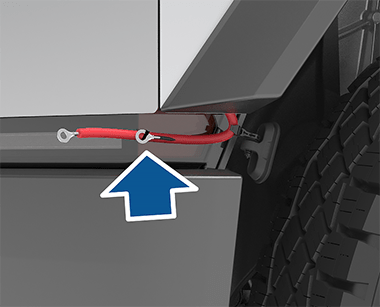 Front of the vehicle shown with an arrow showing the positive and negative terminals attached to the front trunk access terminal cover