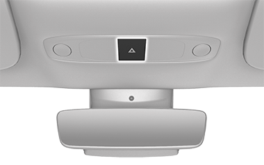 Black button with white triangle above the rear view mirror