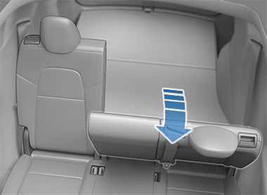 One second row seat folded forward with arrow pointing down